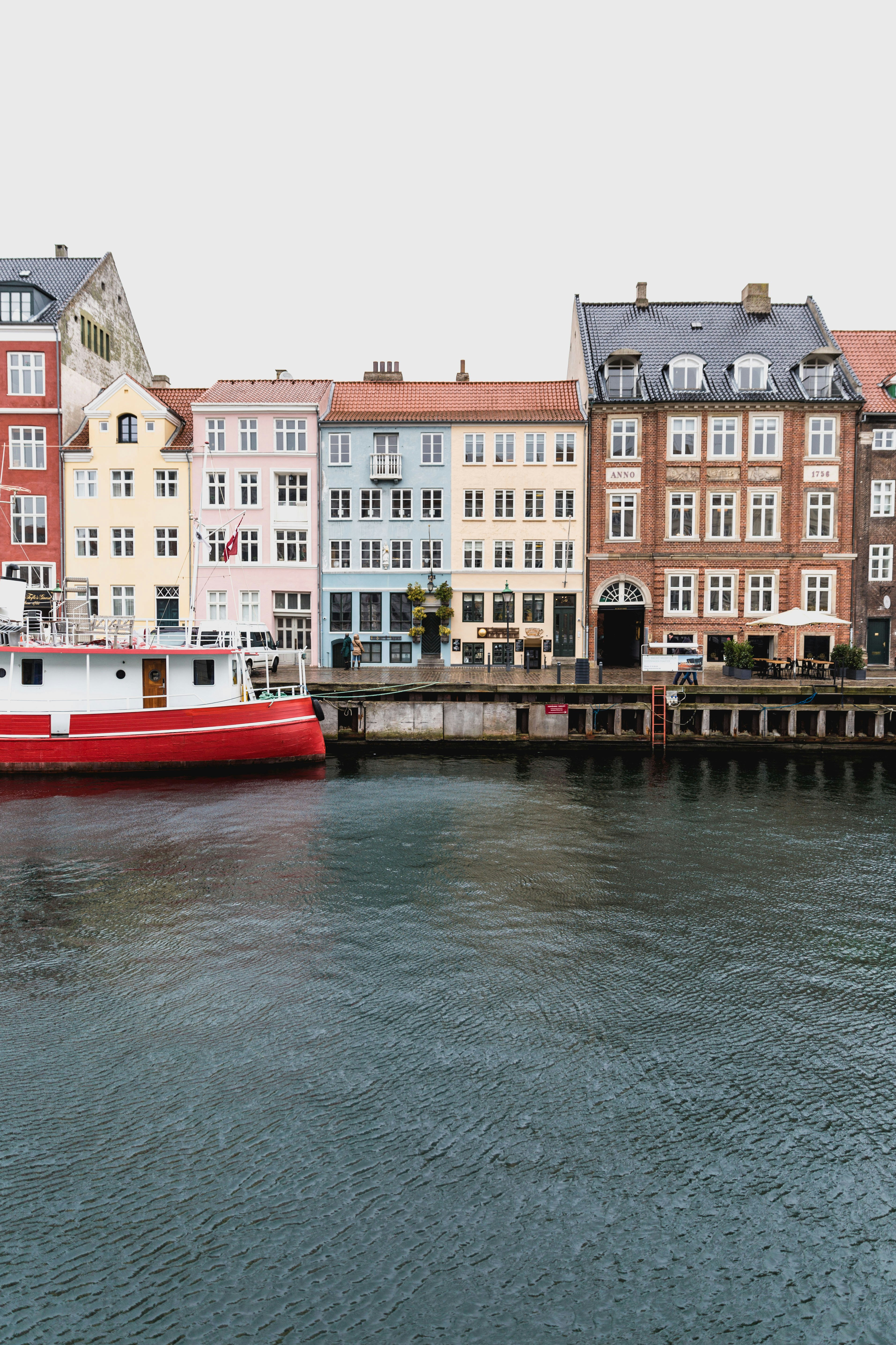 multicolored buildings near body of water taken at daytime